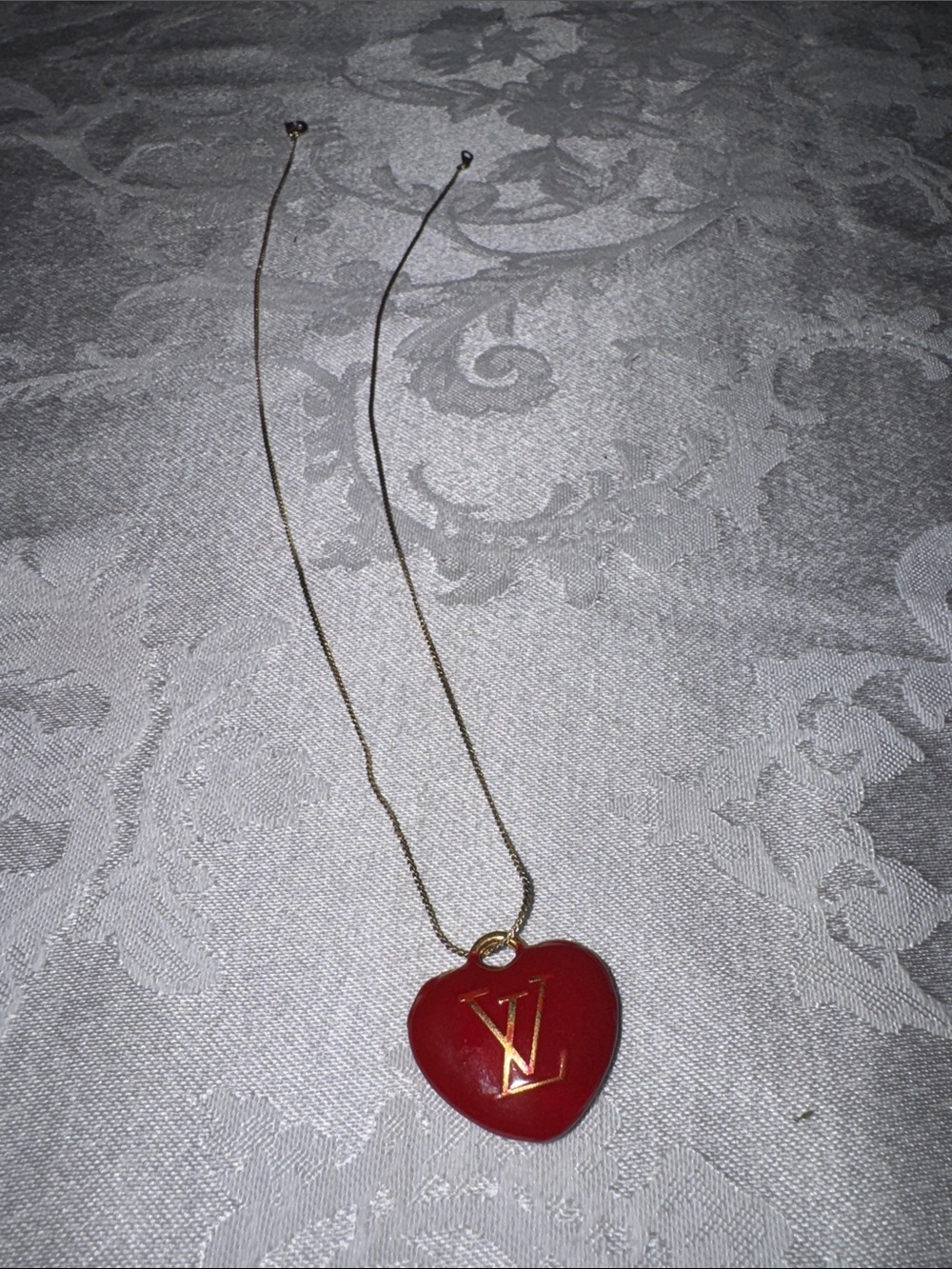 Louis Vuitton Gold-Tone Chain with Red Heart LV Pendant